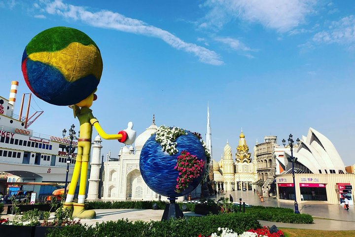 Discover a tapestry of global cultures and art at Global Village where whimsical sculptures and stunning architecture create a unique fusion inviting travelers to experience the world's diversity in one vibrant hub.